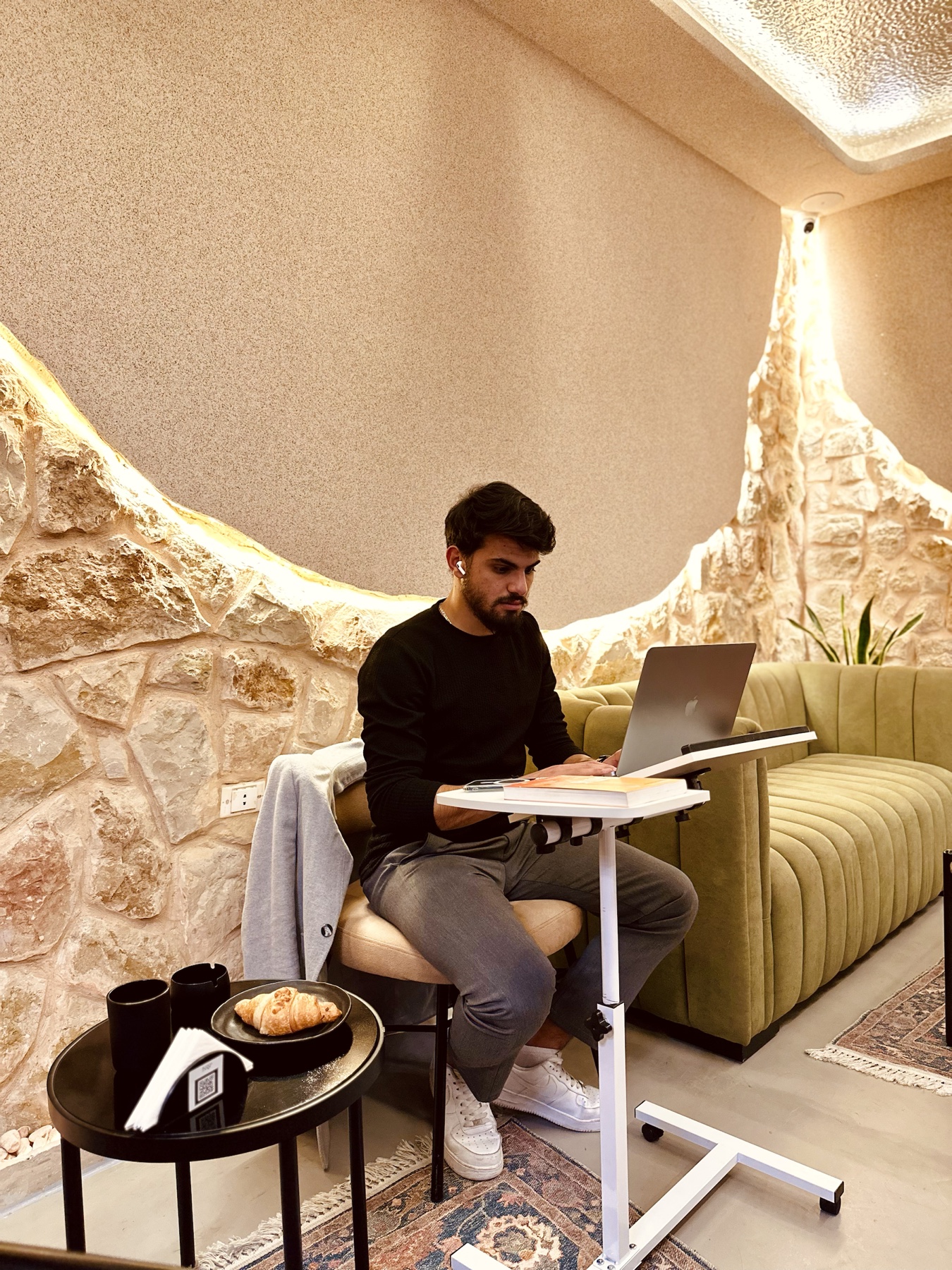 A guest working on a laptop at Business Lounge